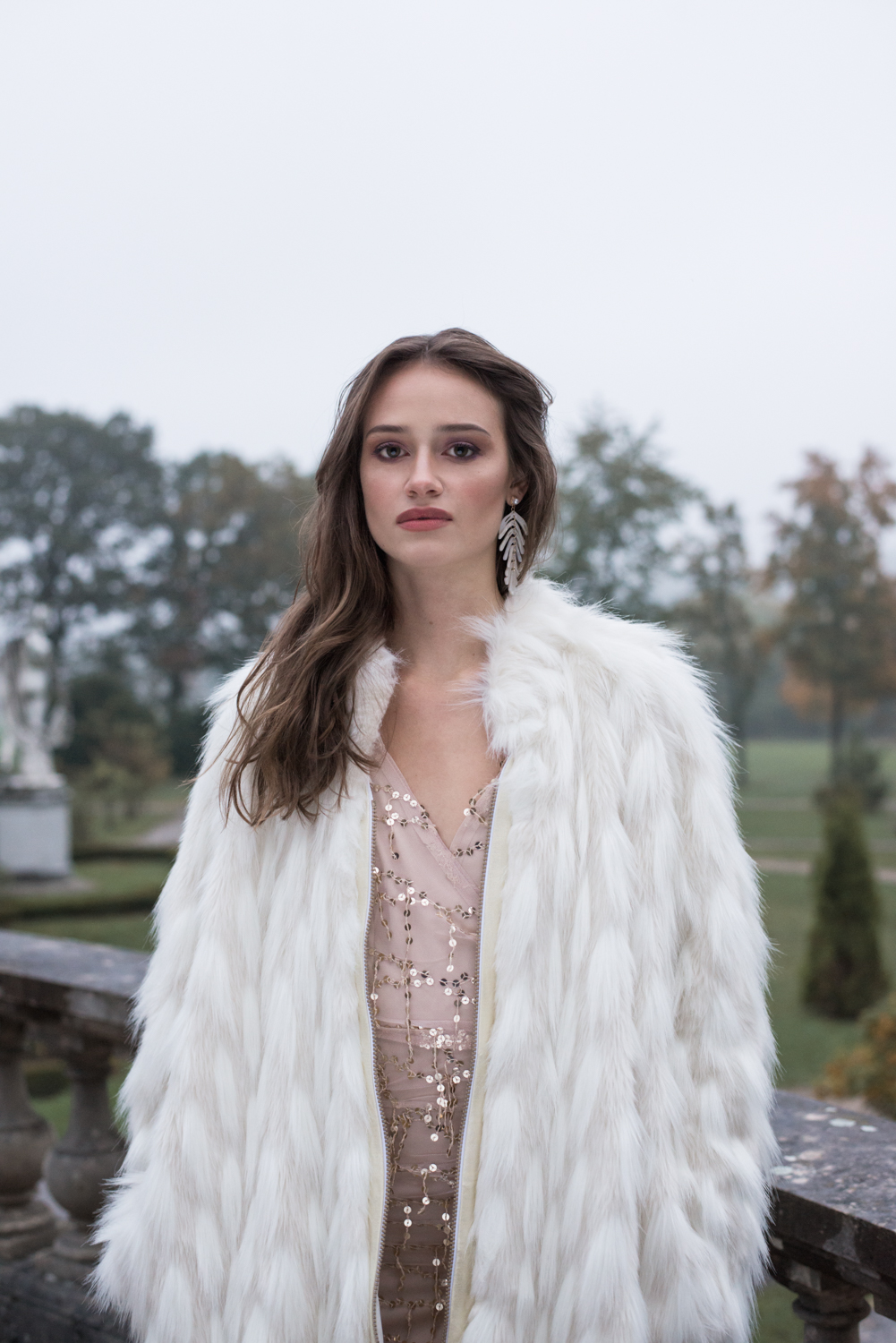 woman at her villa wearing designer fake fur coat by ferrari zoechling